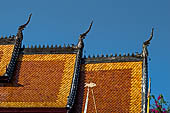 Luang Prabang, Laos - Wat Sene, the sim, the beautiful multi-tiered roof covered with tiles shining under the sun. 